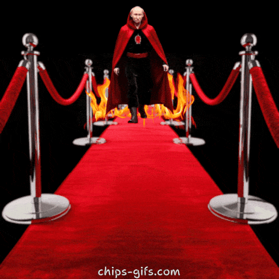  Putin dressed like Satan walks down the red carpet towards the viewer flames following him as he goes The type made of flaming text reads Satan gets the red carpet treatment'